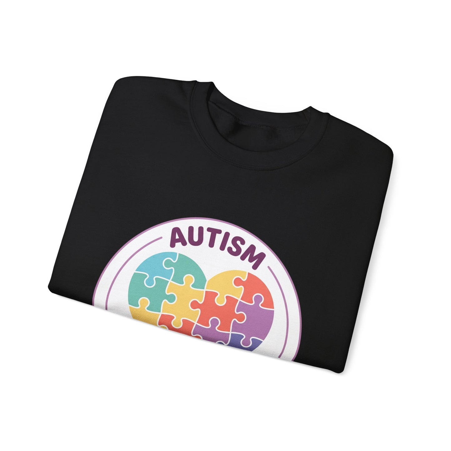 Sweatshirt with autism awareness design featuring a heart made of puzzle pieces on a white background