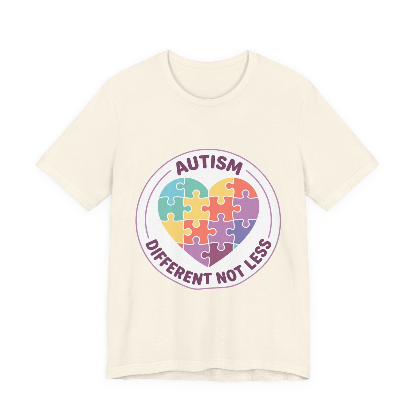 t-shirt with a colorful heart puzzle design and 'Autism Different Not Less' text on a white background