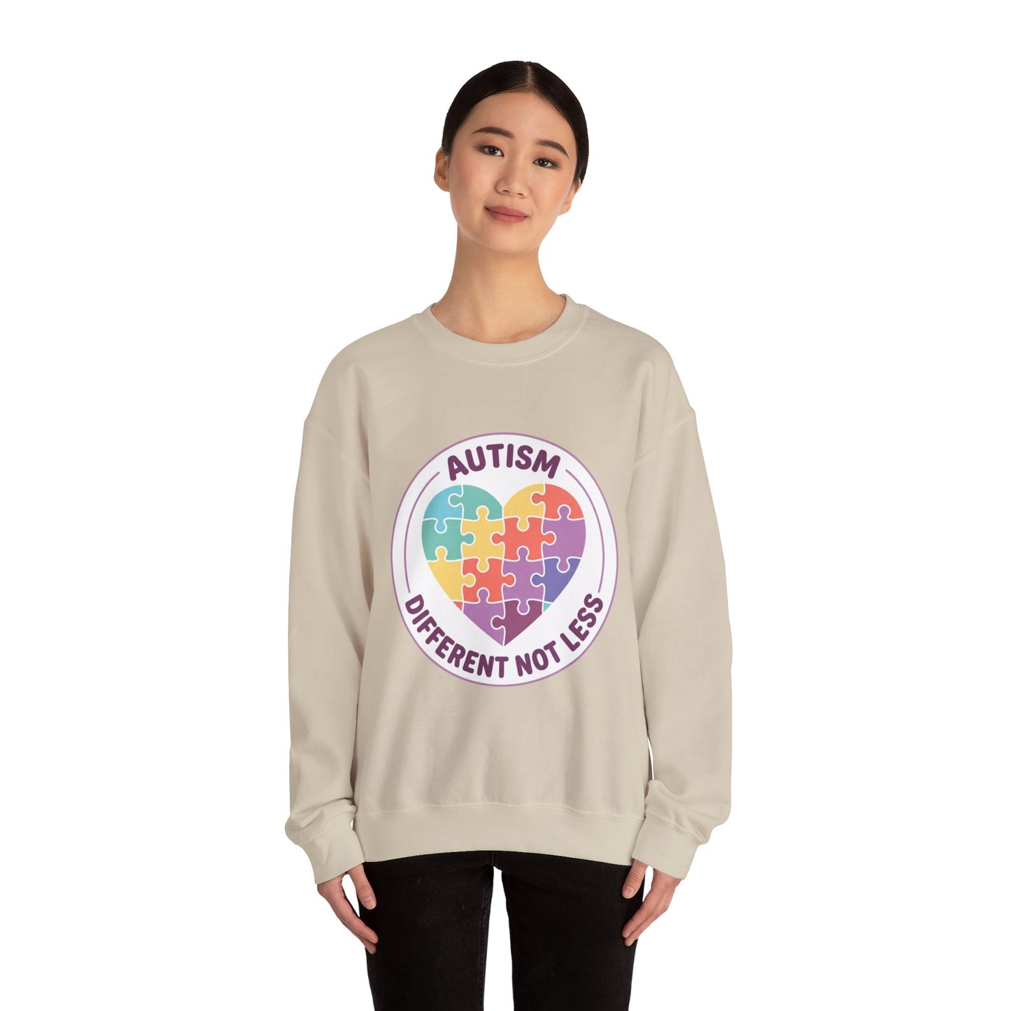Sweatshirt with autism awareness design featuring a heart made of puzzle pieces on a white background
