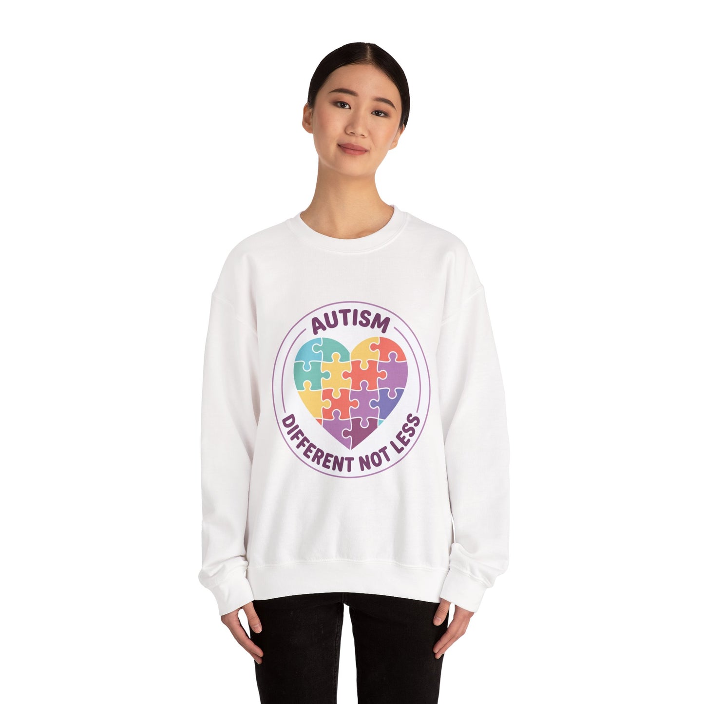 Sweatshirt with autism awareness design featuring a heart made of puzzle pieces on a white background