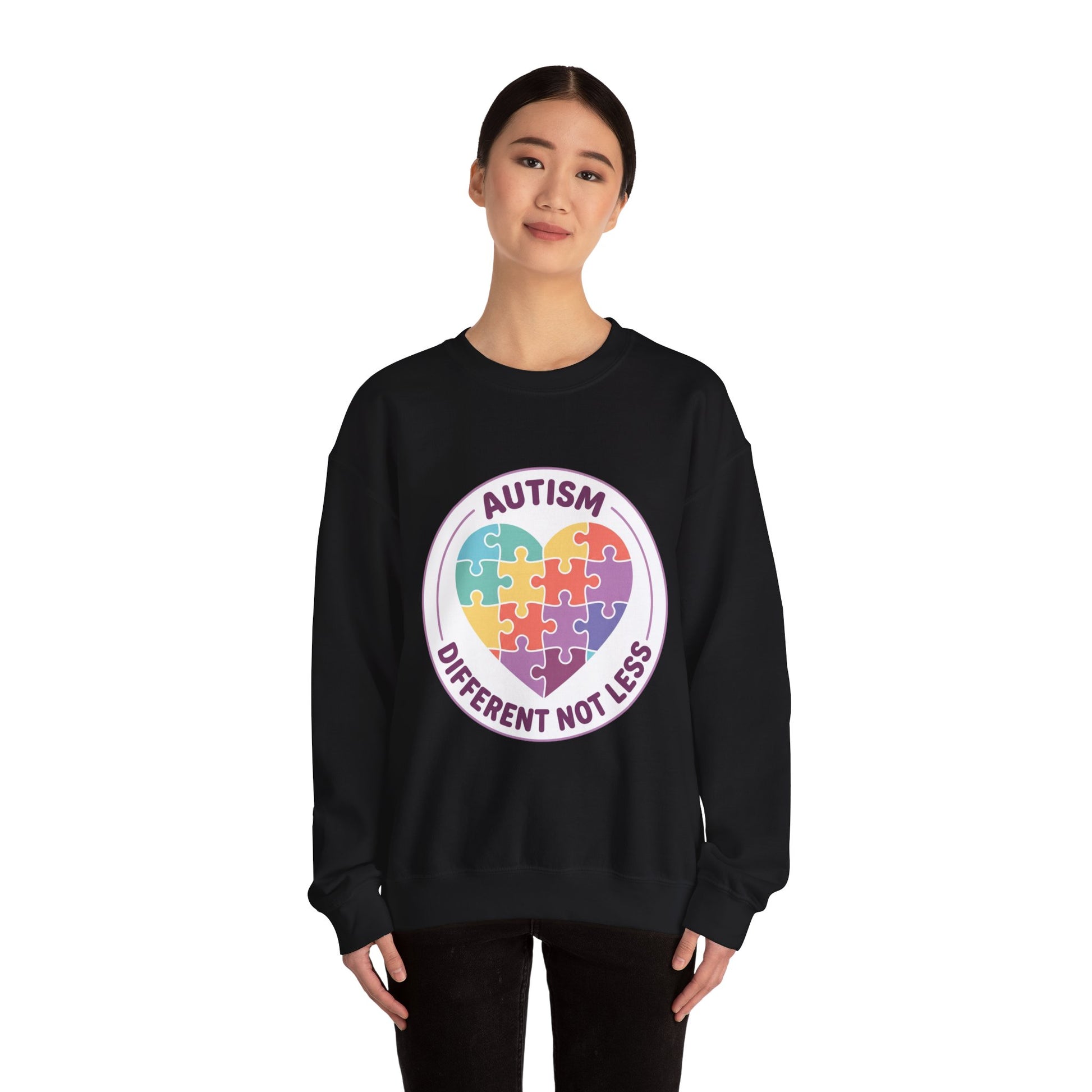 Sweatshirt with autism awareness design featuring a heart made of puzzle pieces on a white background