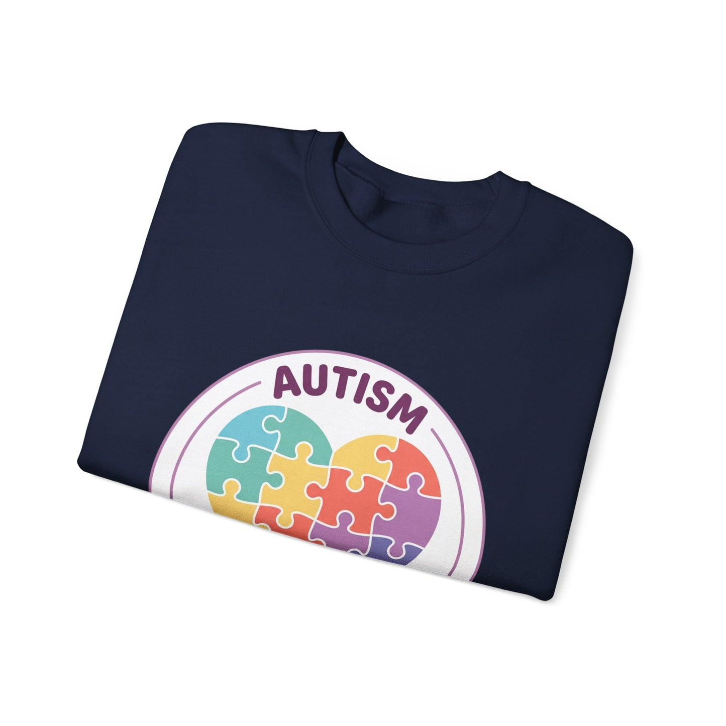 Sweatshirt with autism awareness design featuring a heart made of puzzle pieces on a white background